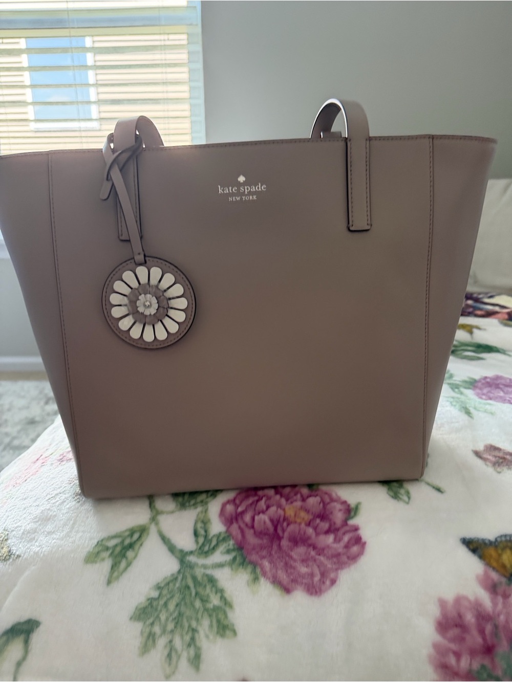 kate spade taupe leather tote with floral charm